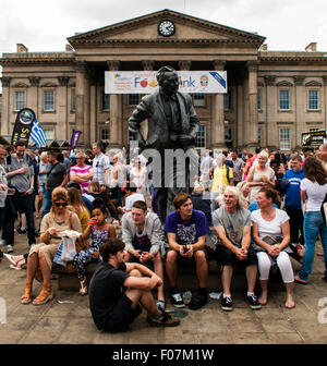 The statue of former Prime Minister Harold Wilson, who was born in Huddersfield, looks out over the  crowds at the annual Huddersfield Food and Drink Festival held in St Georges Sq, Huddersfield, West Yorkshire, UK.  Sunday  9th August 2015 Stock Photo