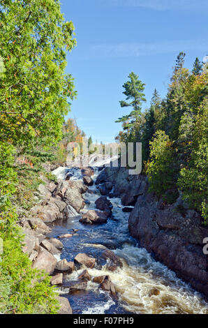 Cascading water over rocks in Superior Lake Provincial park, Canada Stock Photo