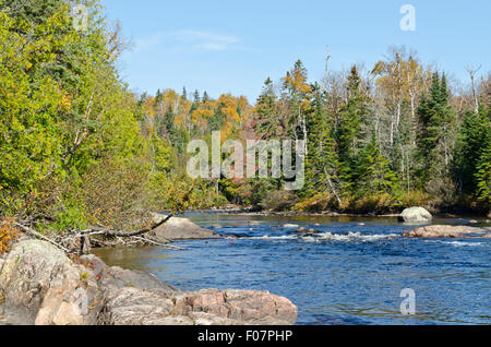 Cascading water over rocks in Superior Lake Provincial park, Canada Stock Photo