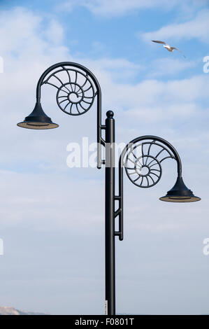 Ammonite style street lamps on the promenade in Lyme Regis, Dorset Stock Photo