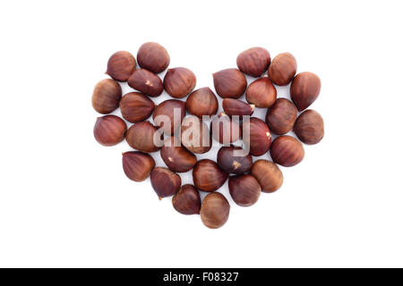 Chestnuts in a heart shape, isolated on a white background Stock Photo