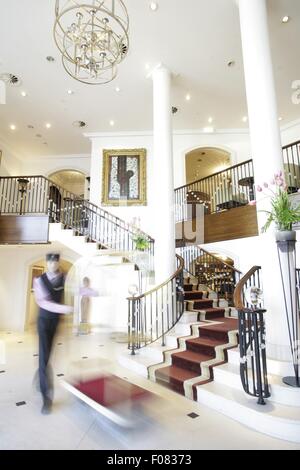 House keeper in Dorint Sofitel Maison Messmer, Baden-Baden, Germany, blurred motion Stock Photo