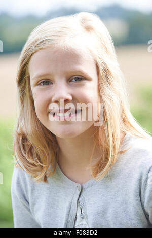 Outdoor Head And Shoulders Portrait Of Girl Stock Photo