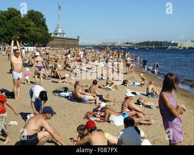 People relaxing at Neva beach in St. Petersburg, Russia Stock Photo