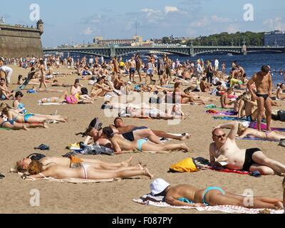 People relaxing at Neva beach in St. Petersburg, Russia Stock Photo