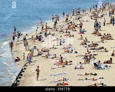 People relaxing at Neva beach in St. Petersburg, Russia Stock Photo