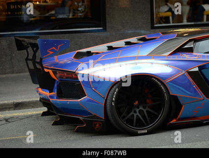 A Lamborghini Aventador with a Tron design cutomised by Oakley Design parked on double yellow lines in Manchester City Centre. Stock Photo