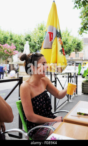 France Holiday 2015 to the Lot Region of South West France Europe Young woman 20s enjoying a coffee in local cafe in Prayssac Stock Photo