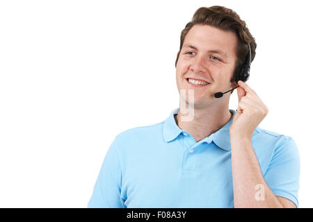 Man Answering Calls In Customer Service Department Stock Photo