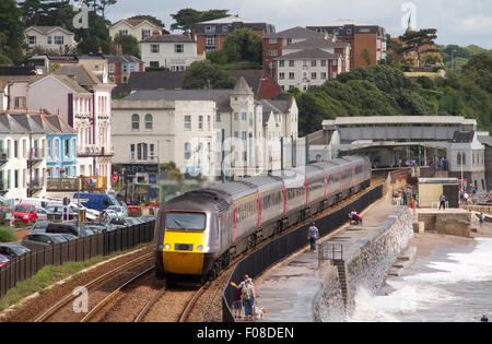 Cross Country HST passes along the famous sea wall at Dawlish Stock Photo