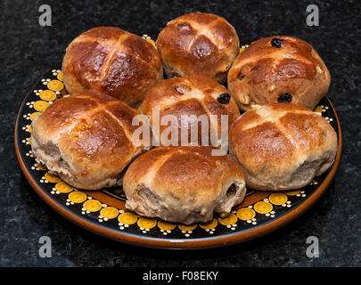 A plate of freshly-baked, home-made hot cross buns on Good Friday Stock Photo