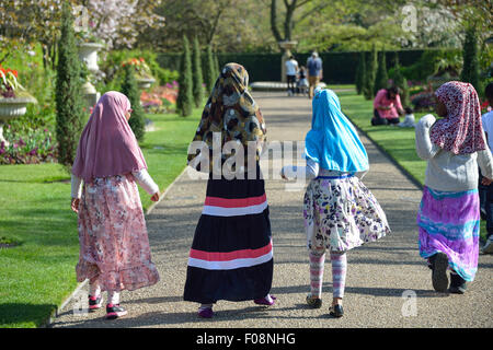 Young Muslim school girls in Queen Mary's Gardens, Regent's Park, London Borough of Camden, London, England, United Kingdom Stock Photo