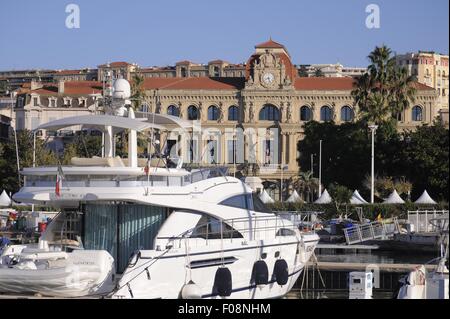 France, French Riviera, the tourist harbor of Cannes, in the background the Town Hall Stock Photo