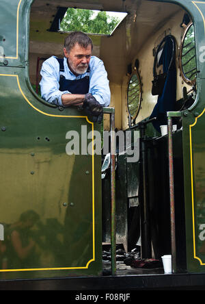 The driver of 0 - 6 - 0 saddle tank loco "Lord Phil" on the footplate. Stock Photo
