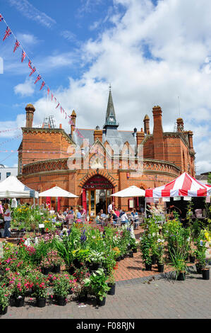 Outdoor stalls on Market Day by Wokingham Town Hall, Market Place, Wokingham, Berkshire, England, United Kingdom Stock Photo