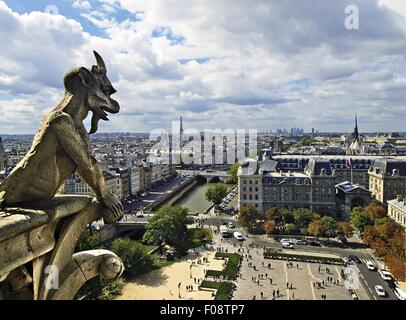 Mythical creatures of Notre-Dame against cityscape of Paris, France Stock Photo