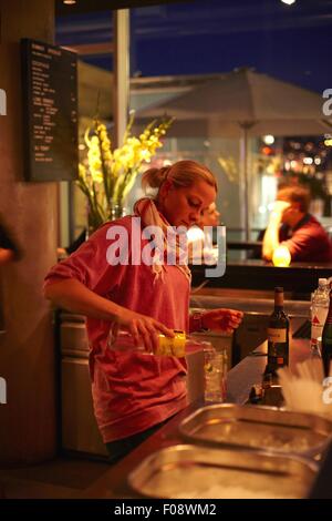 Waitress at Waranga club lounge in Stuttgart, Germany Stock Photo