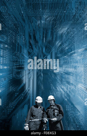 technicians against computers motherboard Stock Photo