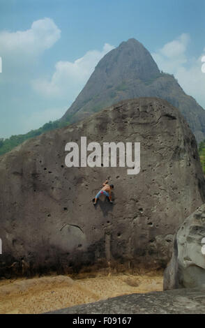Andesit Rokface Rock climber bouldering on andesite rock face in West Java, Indonesia ...