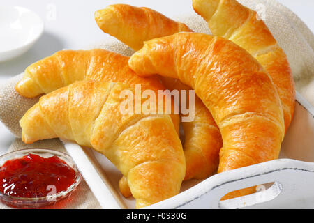 Fresh butter crescent rolls (croissants) with jam Stock Photo