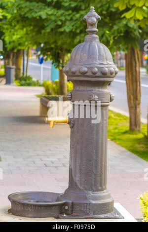 Public drinking water tap on street Stock Photo