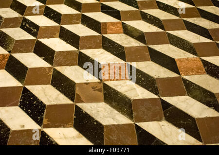 Sienna, Tuscany, Italy. An old trompe l'oeil block design floor in black brown stone and white marble. Stock Photo