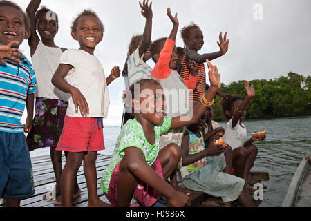 People of Telina Island welcome Visitors, Marovo Lagoon, Solomon Islands Stock Photo