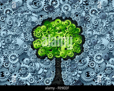 Business tree concept as a symbol for a growing economy and industry represented by machine gears and cog wheels shaped as a growing plant with green leaves as an icon of success in industry activity. Stock Photo