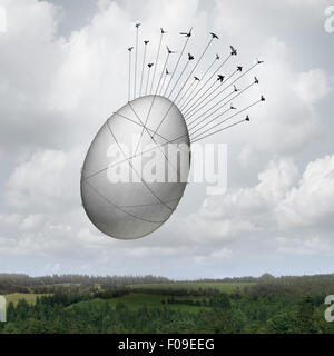 Common goal business concept as a collective team of birds pulling a giant egg with ropes as a financial security symbol and a metaphor for working together for an investing group or company pension teamwork success. Stock Photo