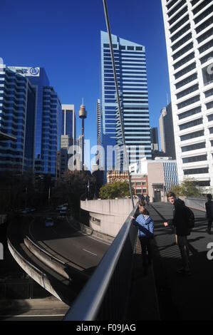 People walking across pedestrian bridge from Darling Harbour towards the CBD, Sydney, NSW, Australia. No PR or MR Stock Photo