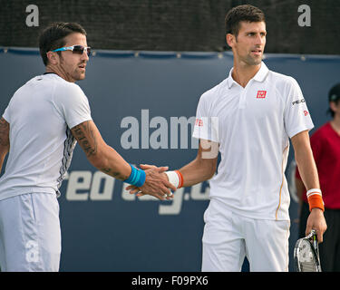 Montreal, Canada. 10th Aug, 2015. Serbia's Novak Djokovic (R) cheers with his partner Janko Tipsarevic during the men's first round doubles match against Italia's Andreas Seppi and Serb Viktor Troicki at the Rogers Cup at Uniprix Stadiumin Montreal, Canada, Aug. 10, 2015. Credit:  Andrew Soong/Xinhua/Alamy Live News Stock Photo