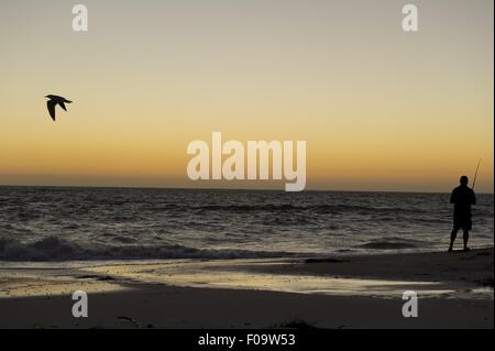 Man fishing in sea at Kalbarri National Park, Cervantes, Australia Stock Photo