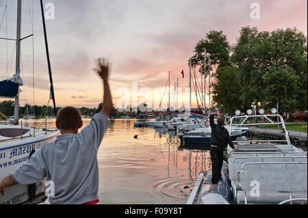 Boats moored at marina in Mikolajki, Warmia-Masuria, Poland Stock Photo