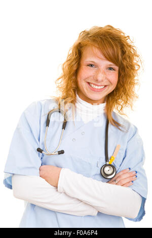 Smiling young nurse in lab coat with arms crossed Stock Photo
