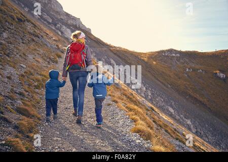 Mother and sons, hiking along mountain path, Karwendel-Mittenwald, Bavaria, Germany Stock Photo