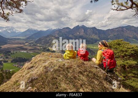 Mother and sons, looking at mountain view, Garmisch-Partenkirchen, Bavaria, Germany Stock Photo