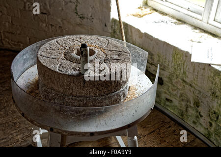 Hand grinding wheel in windmill Stock Photo