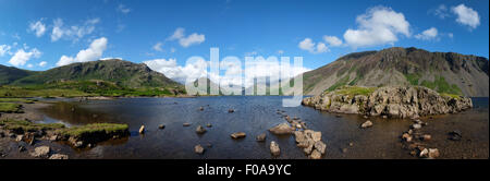 Panorama photo of Wastwater in the Lake District, Cumbria looking towards Wasdale Head, showing the surrounding mountain range Stock Photo