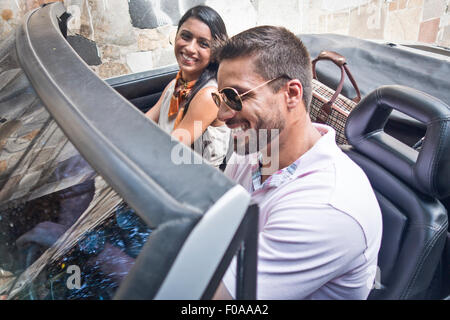 Mid adult couple in convertible car Stock Photo