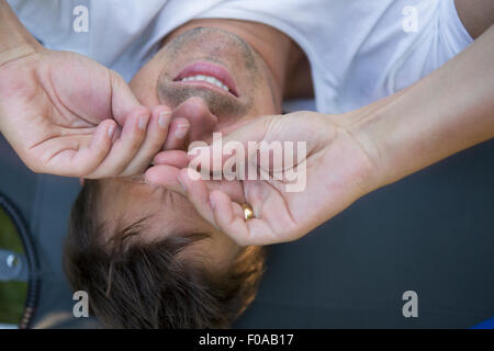 Man rubbing eyes Stock Photo