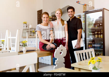 Three people working in cafe, portrait Stock Photo