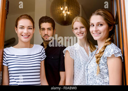Four people looking at camera, portrait Stock Photo