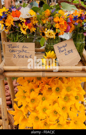 Traditional French market stall with flowers on display, Issigeac, France Stock Photo