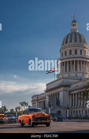 Vintage car driving in front of Capitol Building, Havana, Cuba Stock Photo