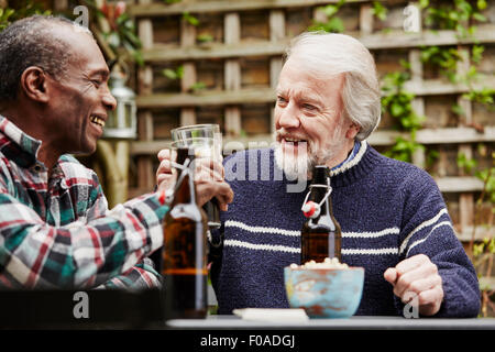 Two senior men drinking beer Stock Photo