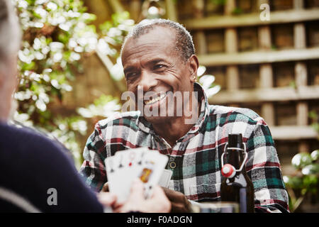 Senior men playing cards Stock Photo