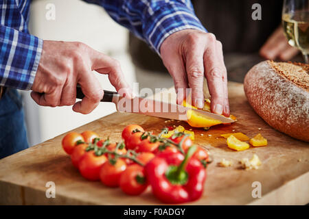 Man chopping vegetables, close up Stock Photo
