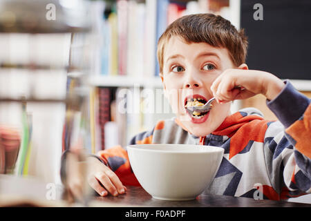 Young boy eating breakfast Stock Photo