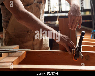 Boat builder in workshop Stock Photo