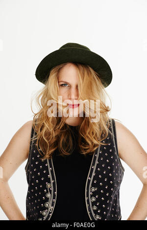 Mid adult woman wearing hat, looking at camera Stock Photo